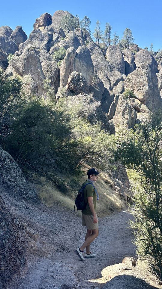 A hiker on the trail below the pinnacles